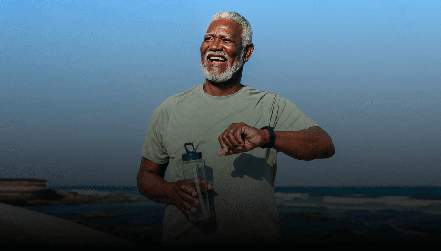 Man over 40 smiling by the beach