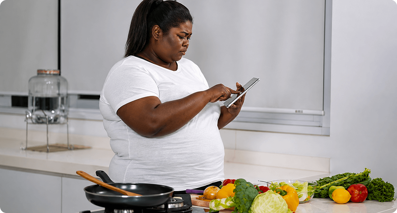 Woman checking her phone beside healthy food