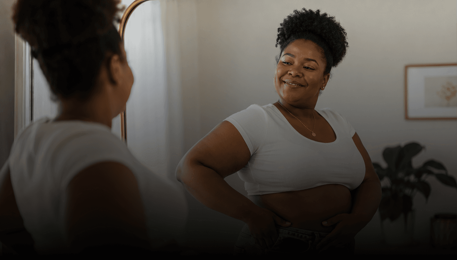 Woman looking in the mirror before an event